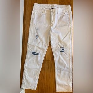 White House Black Market White Jeans with rips revealing denim washed patches